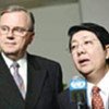 Hans Corell and Sok An of Cambodia  speak to press