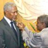 Kofi Annan presented with pin by Elaine Collett