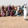 Sudanese refugees wait for food distribution in Tine
