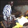 Girl with meningitis being cared for by her mother