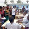 Spontaneous returnees to Liberia register with UNHCR staff
