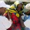 Elderly refugee being assisted in eastern Chad