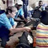 Carol Bellamy (l) with flood victims in Gonaïves, Haiti