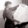 Eleanor Roosevelt holds an English version poster of the Universal Declaration Human Rights (November 1949).