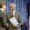 Annan (C) presented with report by Jeffrey Sachs