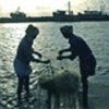 Indian fishermen sort out nets damaged by tsunami