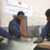 Afghan tinsmiths in training