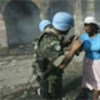 Peacekeepers assisting a civilian in Port-au Prince