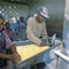 Refugees process maize at Mayukwayukwa camp