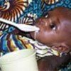 Child being fed at a therapeutic feeding center
