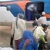 Somali refugees boarding plane for home