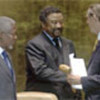 Jean Ping (M) passes gavel to Jan Eliasson, Annan looks on