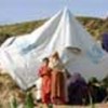 Family begins to dismantle tent at camp in Batagram