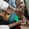 Child receives measles vaccination at health centre