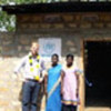 Edward Benson & residents of a new UNHCR-funded shelter