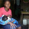 Mother breastfeeds her baby at Nangweshi Camp