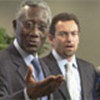 Lamine Cissé (L) and Toby Lanzer speak to reporters