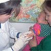 An infant being vaccinated against measles