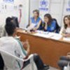 A. Jolie sits in as UNHCR staff interview refugees