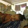 Child sleeping under insecticide-treated bednet