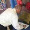 UN Staff member signs condolence book