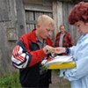 TB patient signs a register after taking his medication