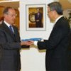 Antonio Maria Costa presents UN flag to Ambassador Kim Sung-Hwan