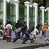 UN peacekeepers try to disperse  demonstrators from the Haitian National Palace