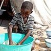 Child in camp for families displaced by flooding