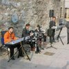 Roma musicians performing outside the national gallery, Cifte Amam, in Skopje