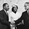 Dr. Martin Luther King and Mrs. King are greeted by Ralph Bunche on a visit to the United Nations in 1964.