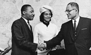 Dr. King and Coretta Scott King are greeted by Ralph Bunche, UN Under-Secretary for Special Political Affairs. (file)