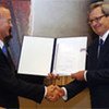 US Ambassador Gregory Schulte (left) delivers  instruments of ratification to IAEA's Johan Rautenbach