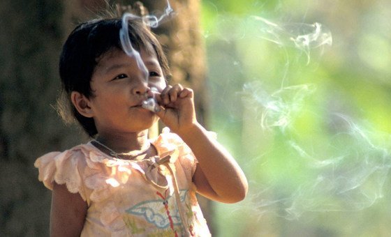 A young girl smoking. 