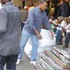 Displaced foreigners offload UNHCR sleeping mats in Germiston (South Africa)