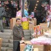 A refugee working in a market in Kyiv