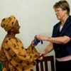 SRSG Løj presents keys to Safe House for Women to Rosana Schaack, Executive Director of THINK