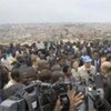 Secretary-General Ban Ki-moon (in UN blue cap) briefing correspondents during his visit to  Kibera last year
