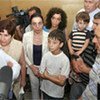 António Guterres talks to displaced people in a collective centre in Tbilisi