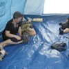 Group of displaced Georgians relax in their UNHCR tent on the outskirts of Gori