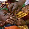 A boy receives vitamin A droplets