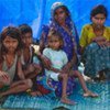 Maja Devi Yadav with her family in a camp near the eastern flood area