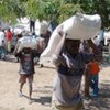 IDPs collect rations at food distribution center, Goma