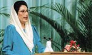 Benazir Bhutto speaks at a podium during a political event.