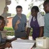 WHO staff check patients' cholera records at a clinic in Harare, Zimbabwe