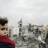 A young child in Gaza observes damage caused by Israeli air strikes which began on 27 December 2008.