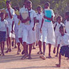 Schoolgirls return from school to the Mavadivrampu camp for displaced people in eastern Sri Lanka