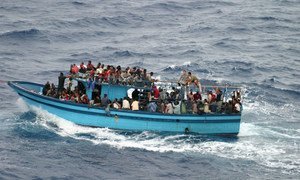 A boat carrying asylum seekers and migrants in the Mediterranean Sea.