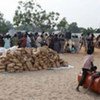 Internally displaced people wait for aid at a distribution point in eastern Sri Lanka