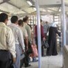 Palestinians wait in a queue at Beit Iba checkpoint in Gaza